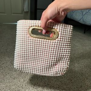 Pink purse with pearls and gold details